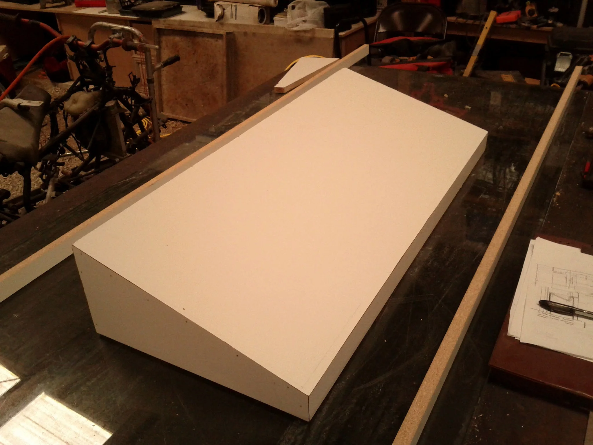 The wedge-shaped box will create the void of the concrete sink.