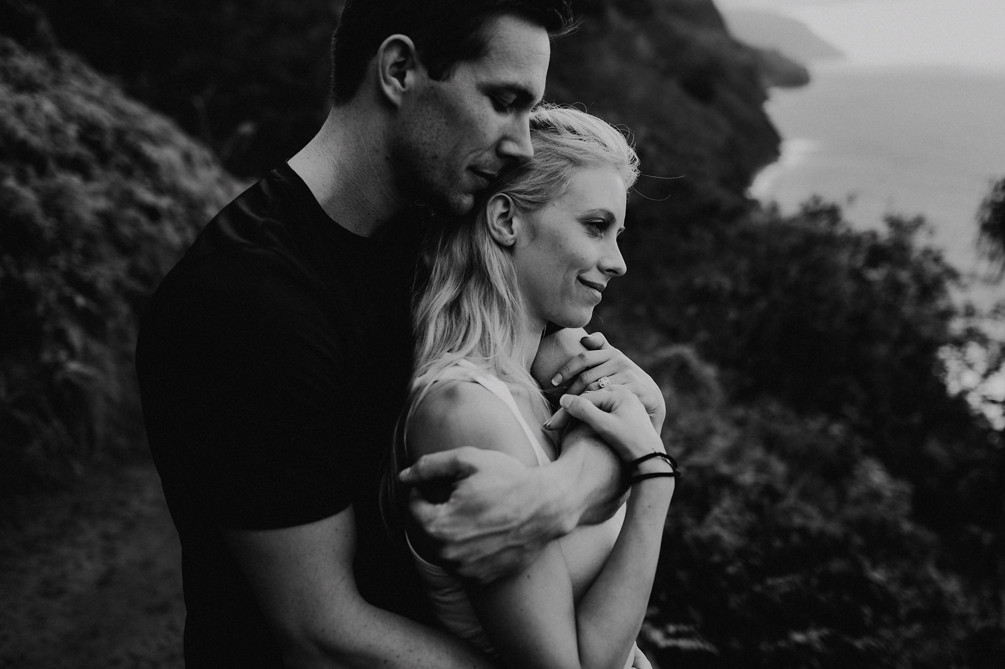 hawaii kauai elopement na pali coast mountain hike bride groom hugging photo