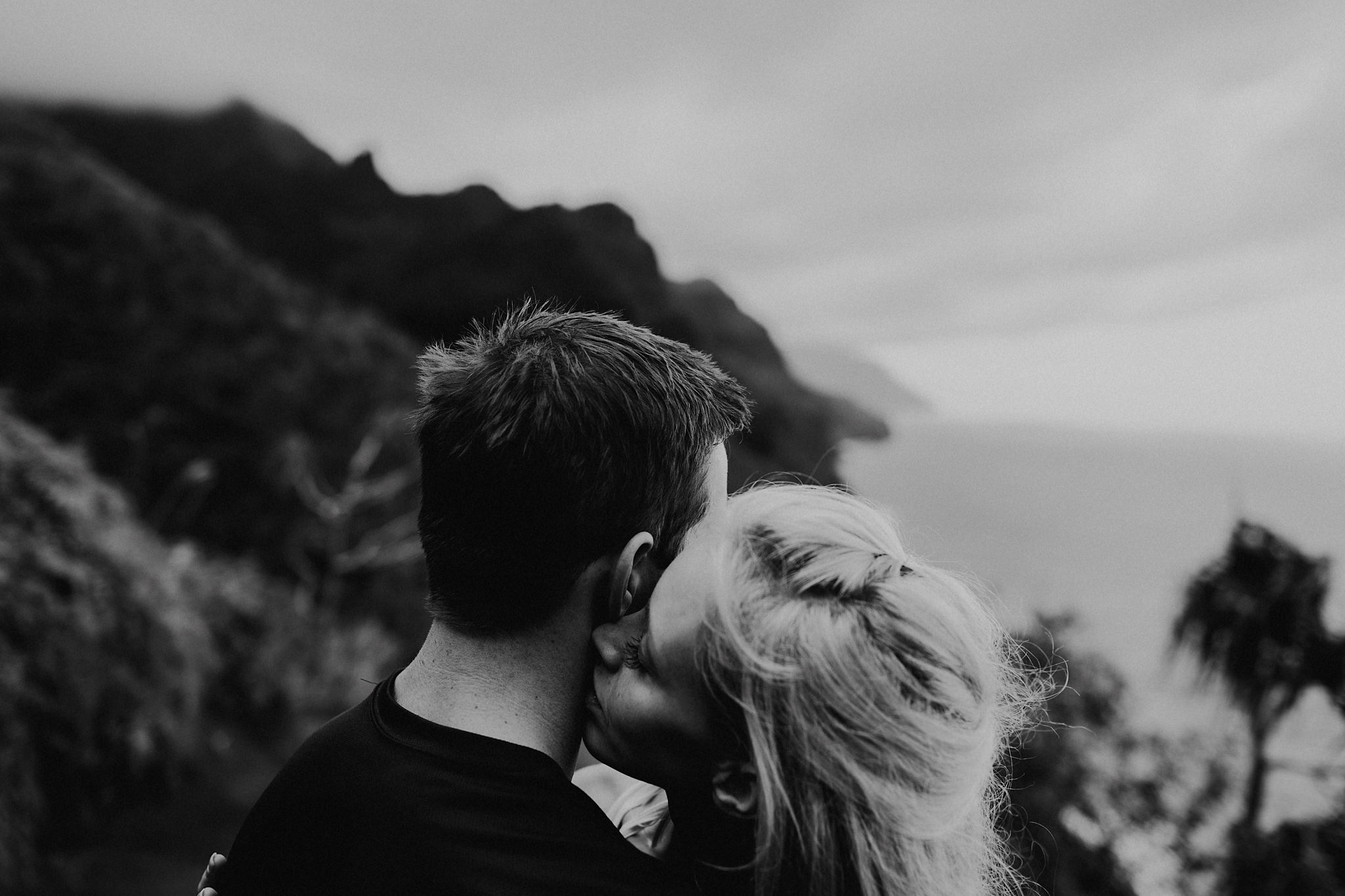 hawaii kauai elopement na pali coast mountain hike bride groom hugging photo