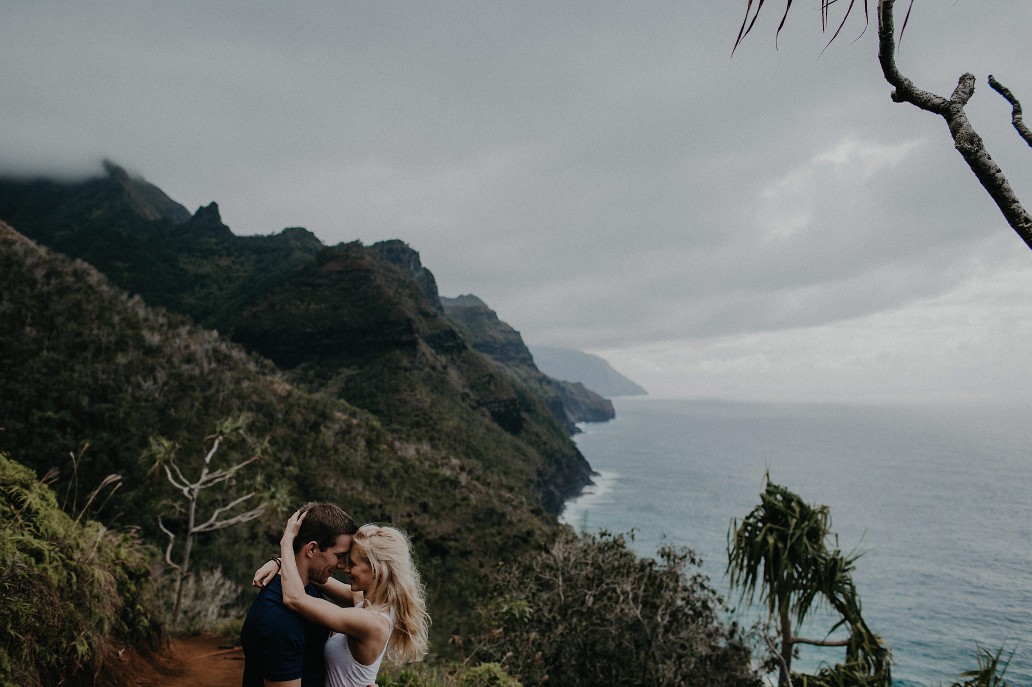 hawaii kauai elopement na pali coast mountain hike bride groom hugging photo