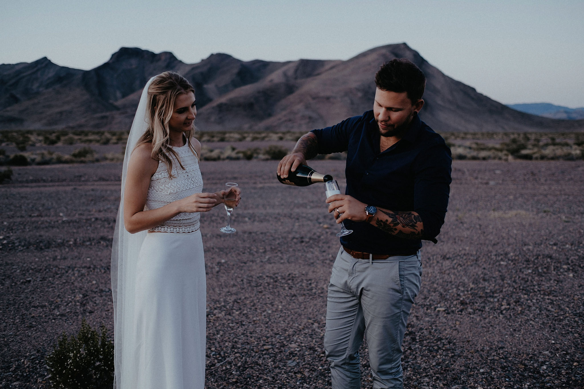 death valley adventure elopement wedding photographer national park couple sunset portrait champagne