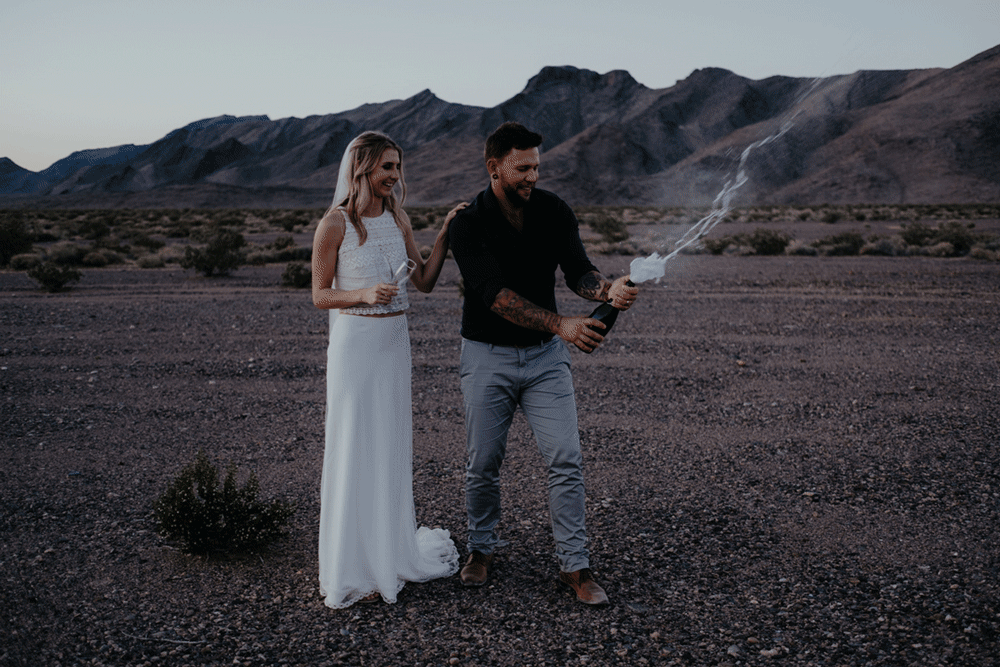 death valley adventure elopement wedding photographer national park couple sunset portrait champagne