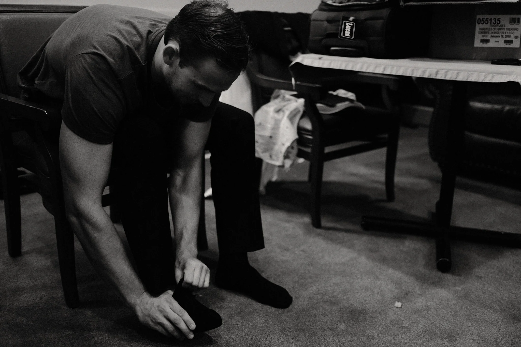 black and white groom getting ready photo