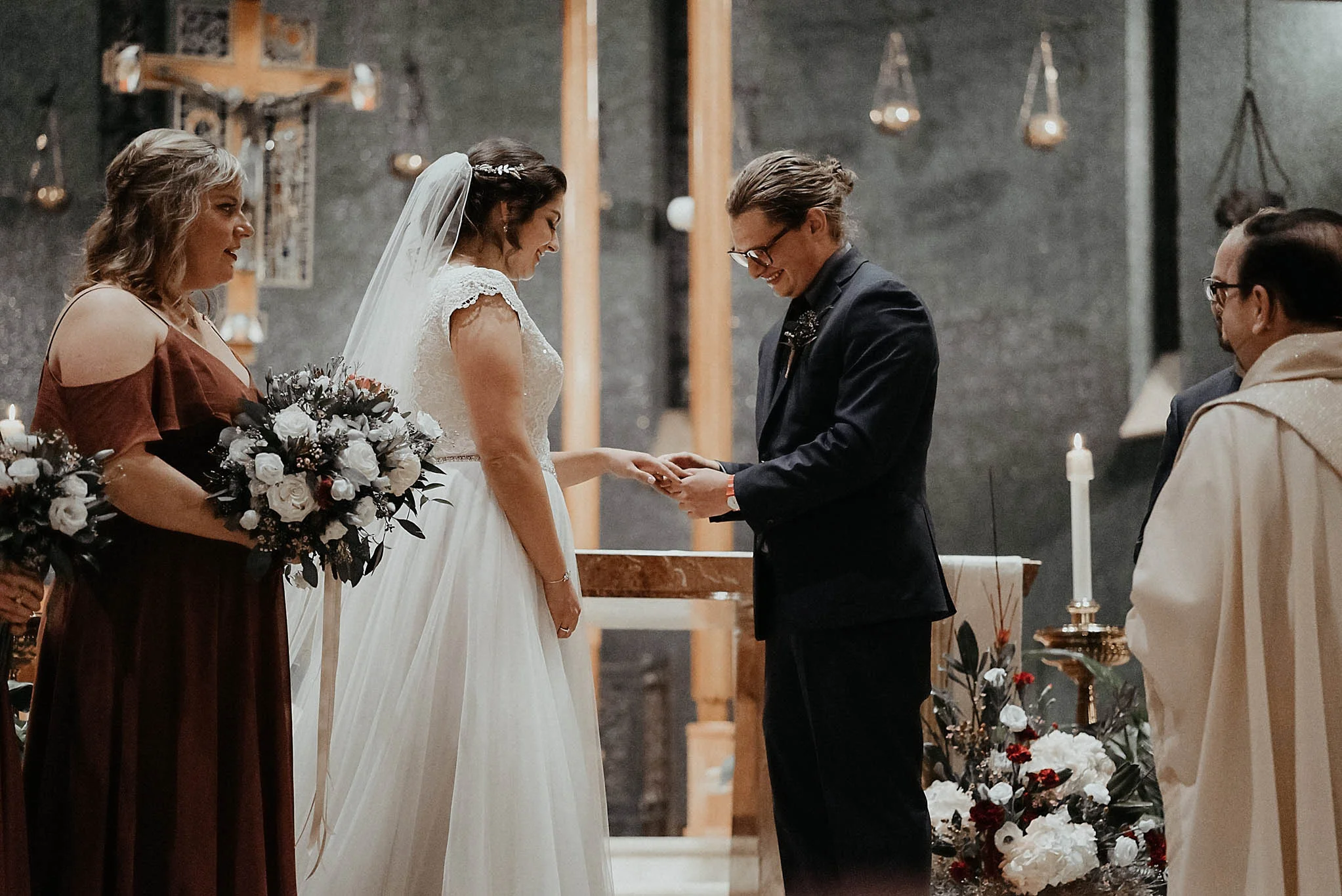 cincinnati warehouse wedding photographer cathedral church ceremony putting on ring