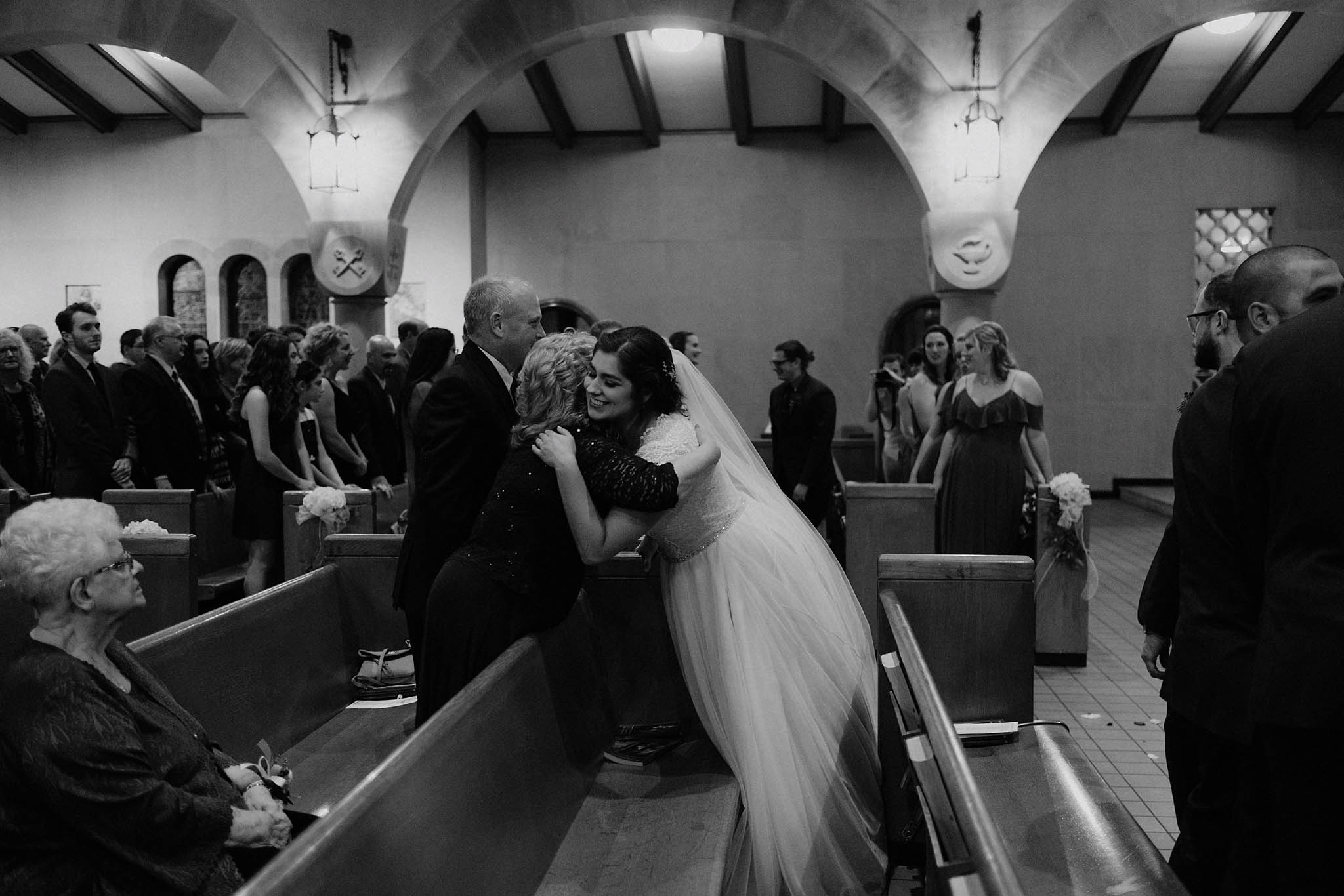 cincinnati warehouse wedding photographer cathedral church ceremony bride hugging