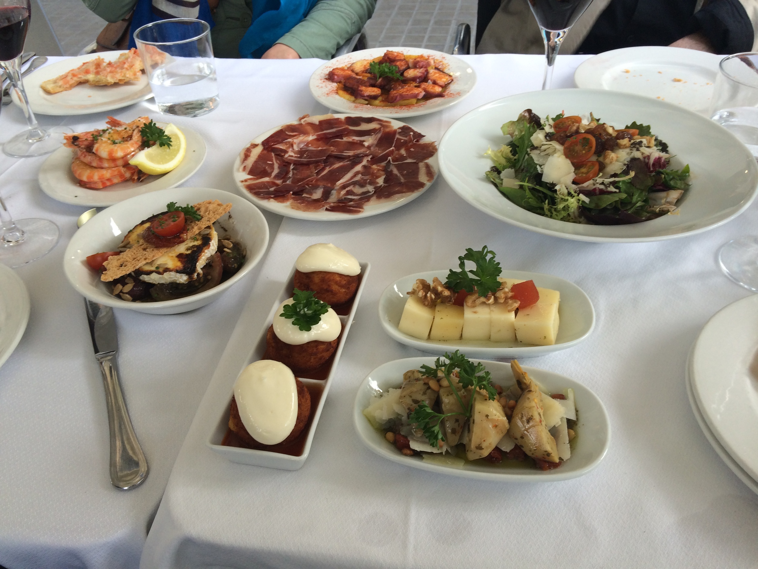 A selection of tapas from jamon to prawns, octopus, and two cheese selections and veggies, and finally a potato-meat ball. Delish!