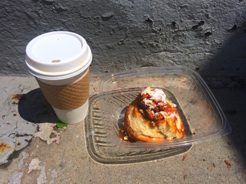 Enjoying a delicious cinnamon roll from Baked in Brooklyn on the stoop.