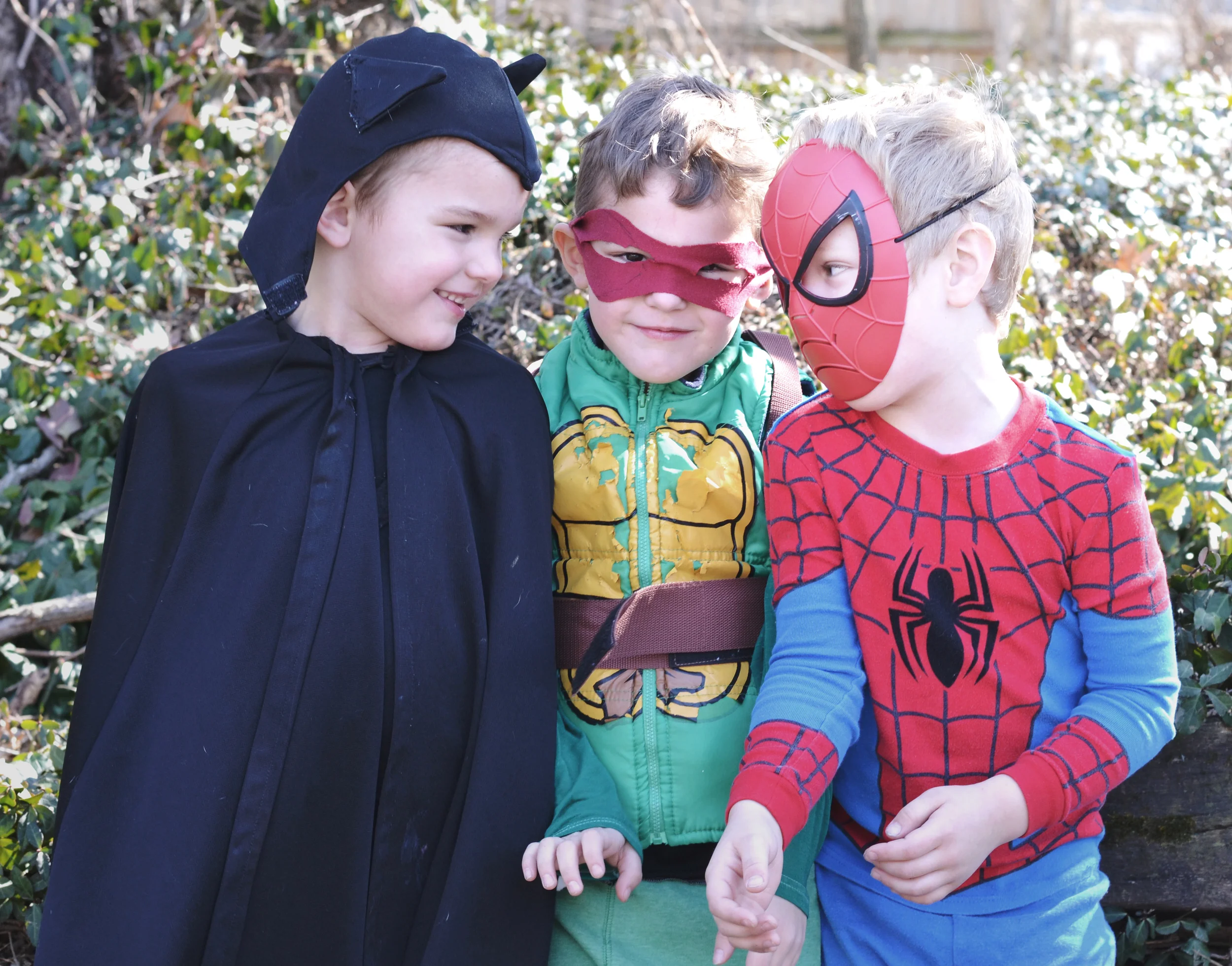 Cheesy smiles and maniacal laughter. It was a costume concert - Mayer as Batman (vintage - OG!), Marley as Raphael and Soren as Spiderman (he's a little obsessed...)