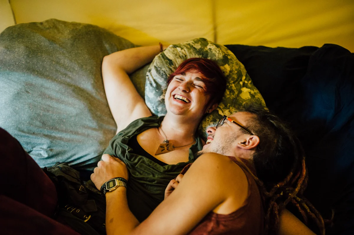 couple laughing in tent