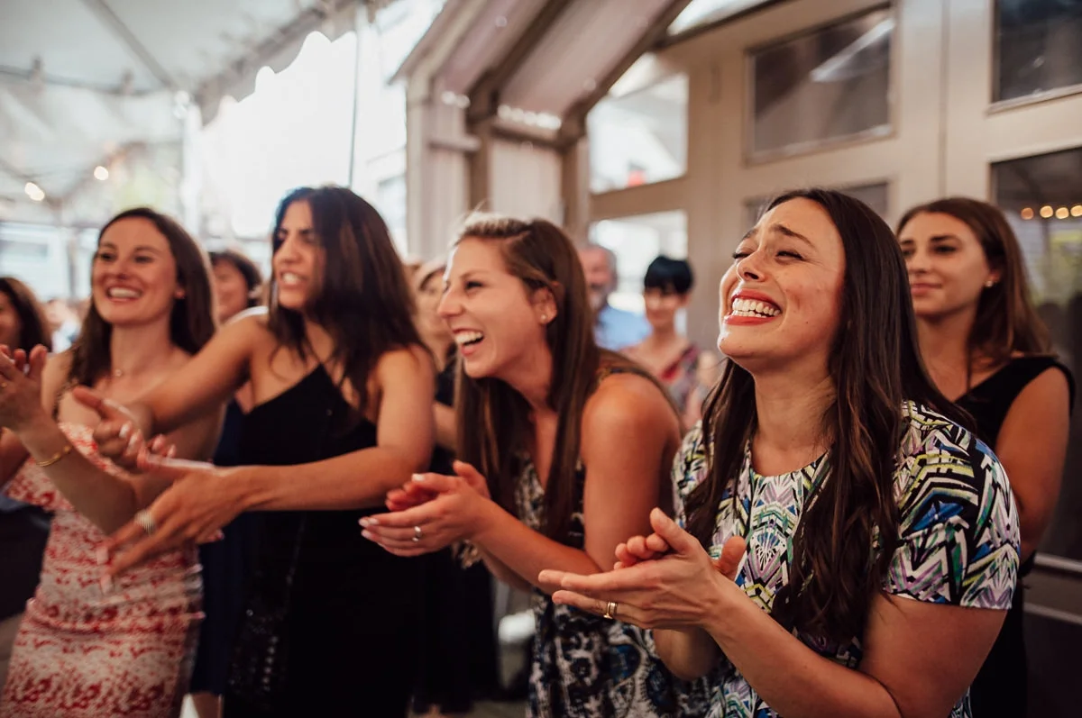 guests laughing at Toronto wedding