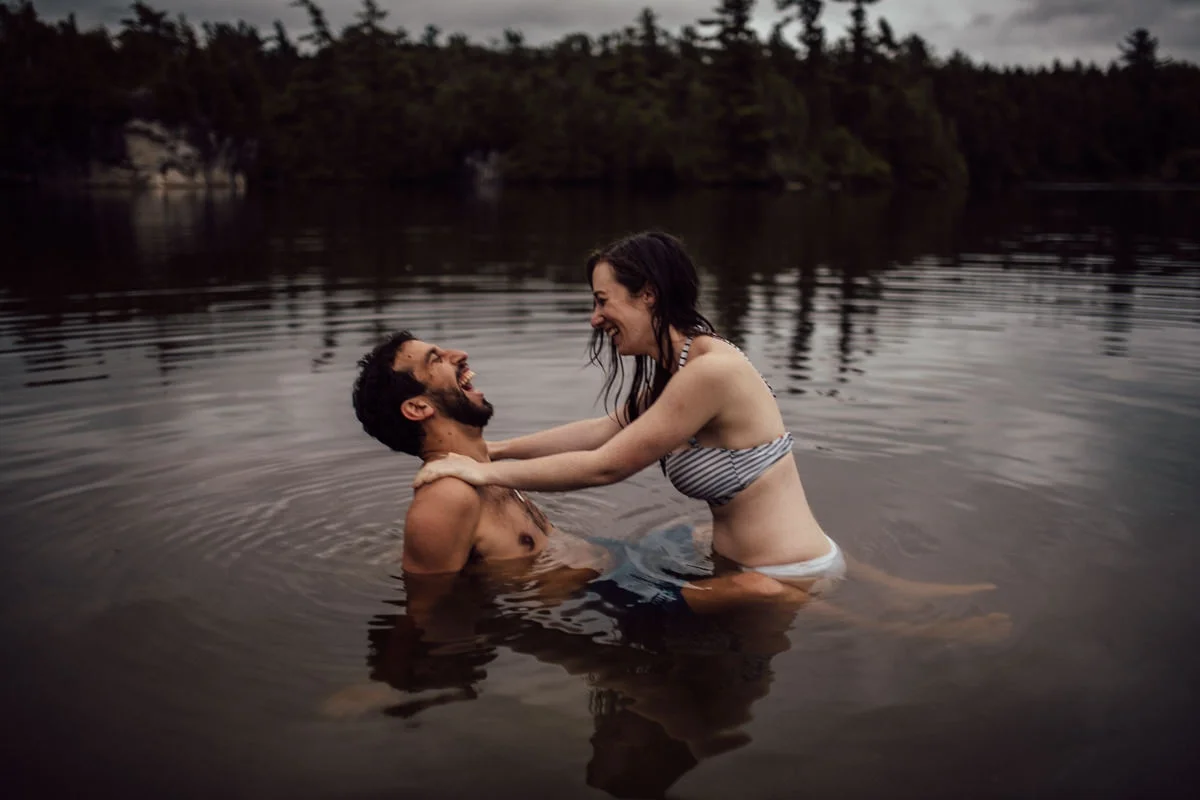 Couple laughing in water