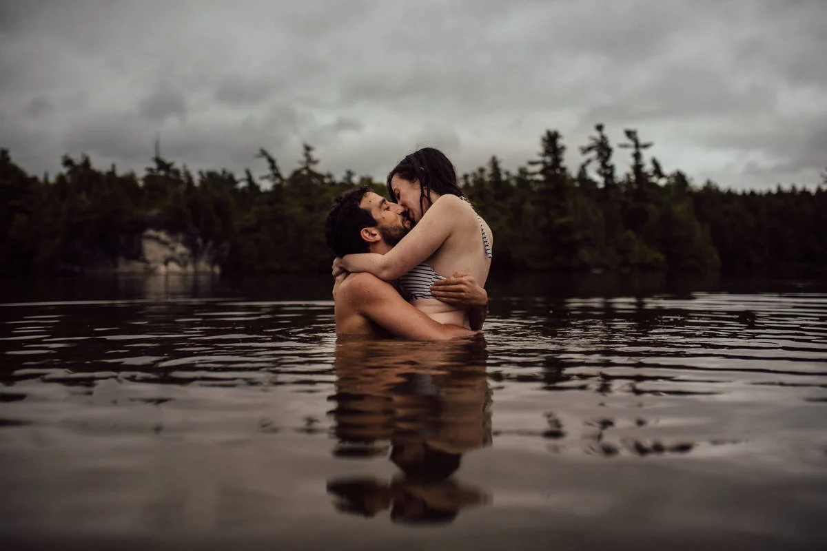Couple kissing in water