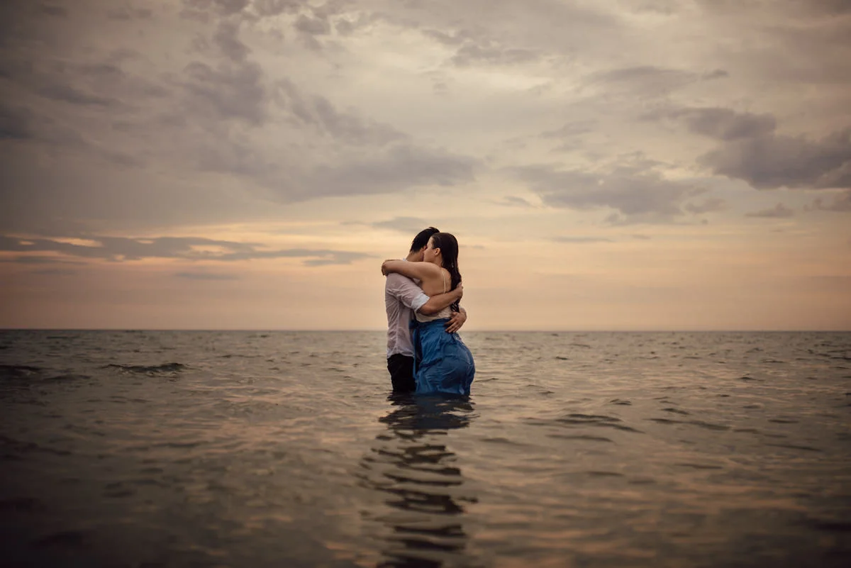 Couple in love hugging in water