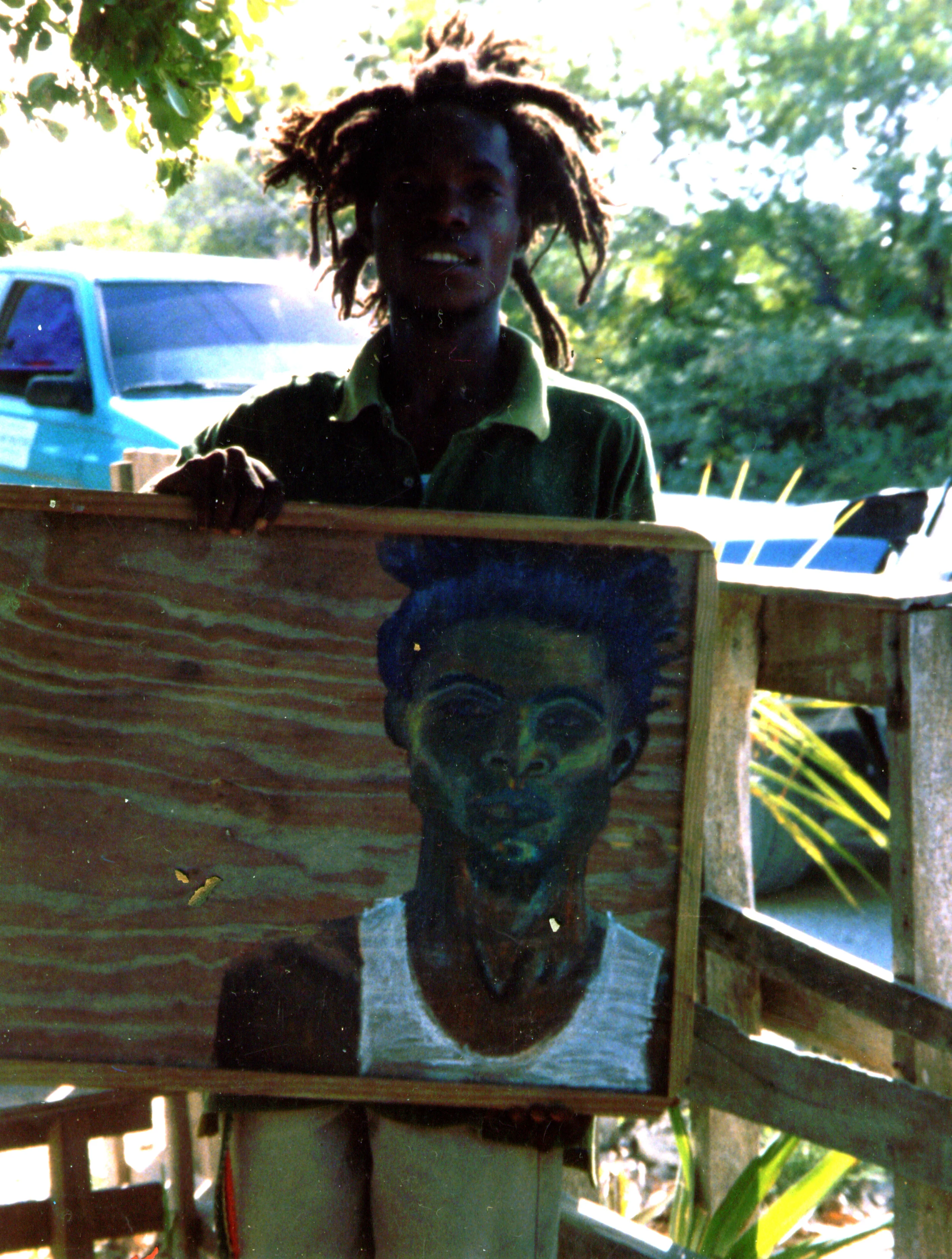 SHAQ HOLDING PAINTING.jpg