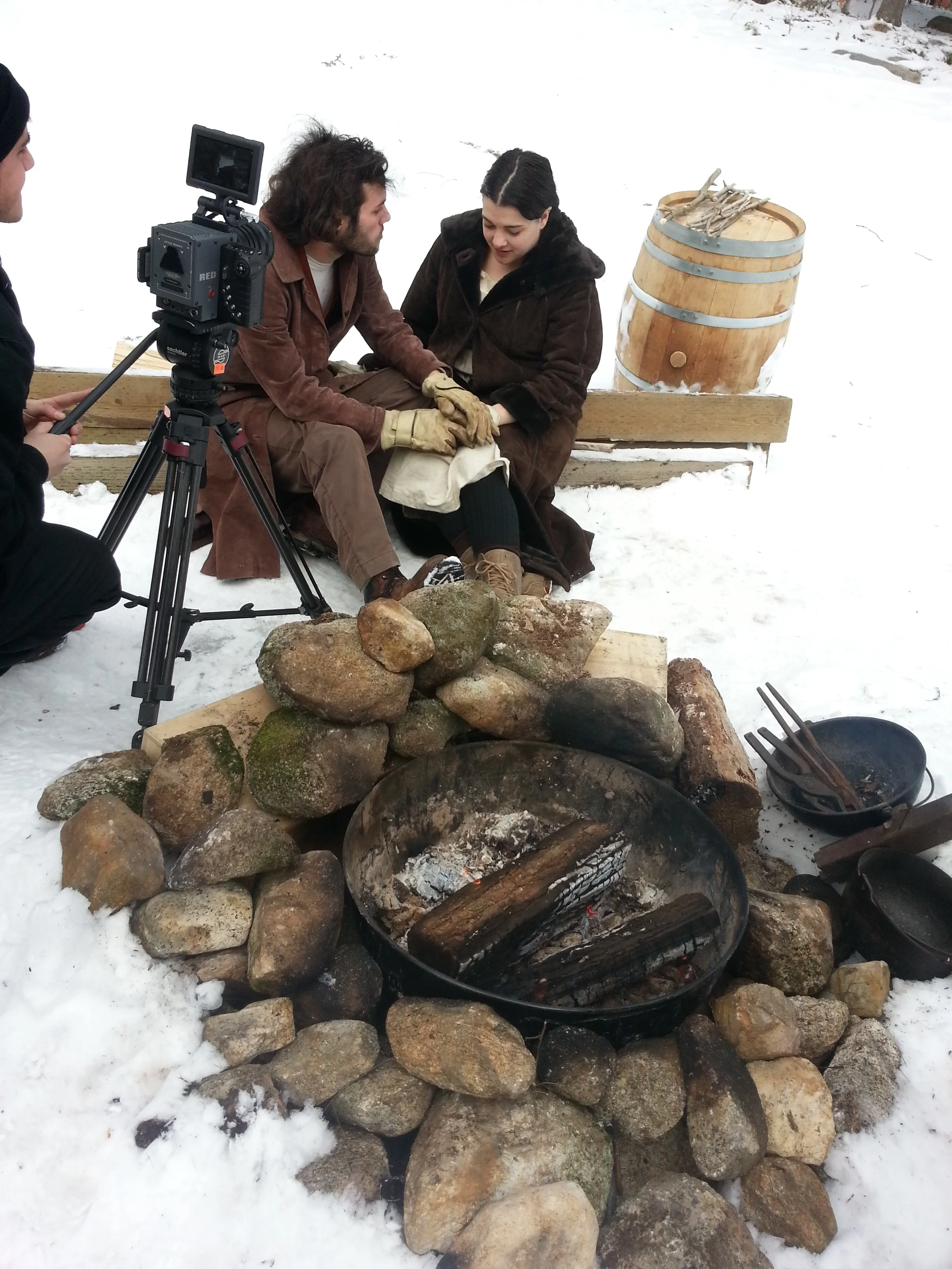 Filming their falling in love by a fire