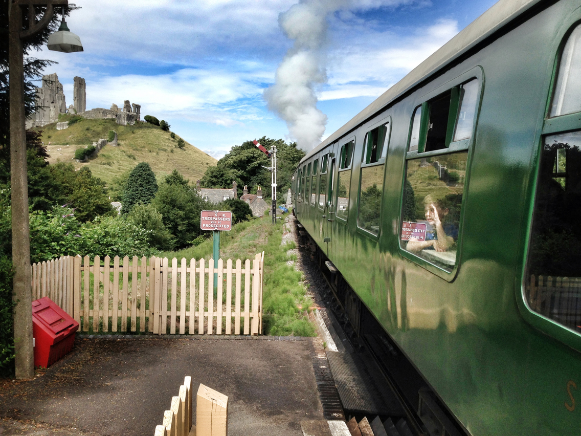 A square crop would have forced us too far from the boy on the train or removed the focus of his attention – the castle.