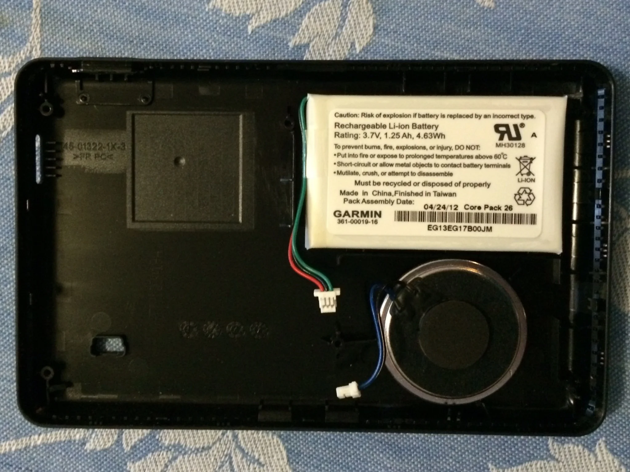 The speaker and battery are glued to the back case.