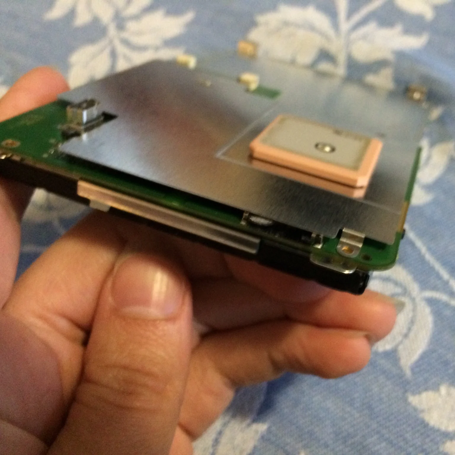 The tiny nub of broken microSD card, sticking out of the slot.