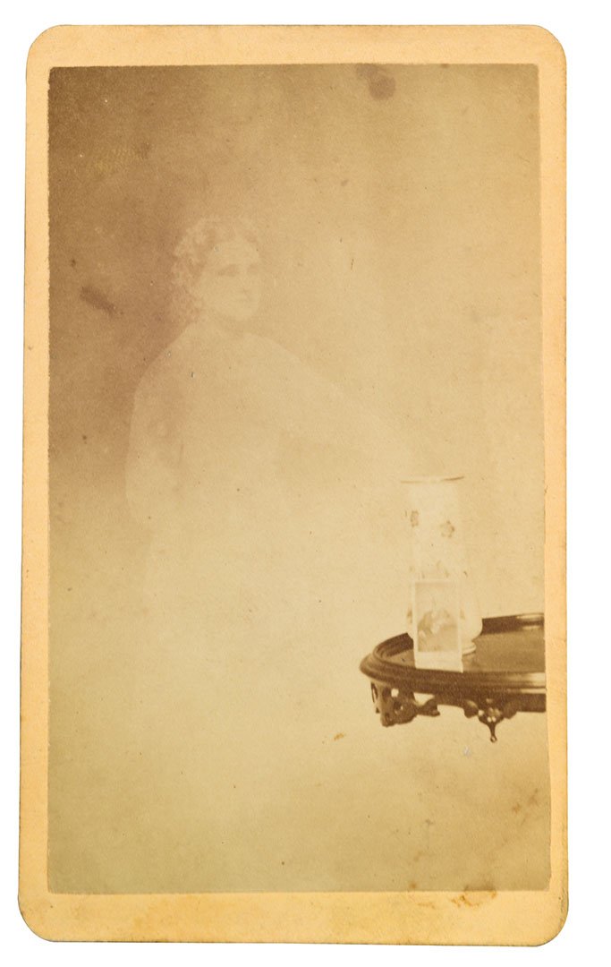 A spirit beside a photograph of an absent client. William Mumler, c.1870.