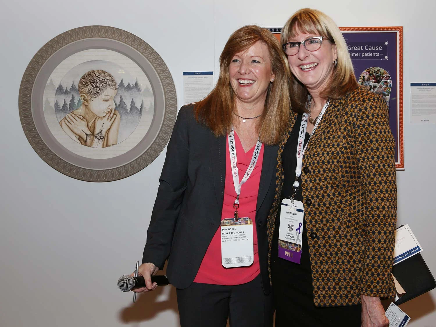 Myrna Dow (right), President and Founder of High Desert Frameworks Inc, Bend Oregon with Jane Boyce (left), President Tru Vue Inc. Photo Credit Mark Wallenfang 2019. West Coast Art and Frame Expo 2019 Las Vegas NV.