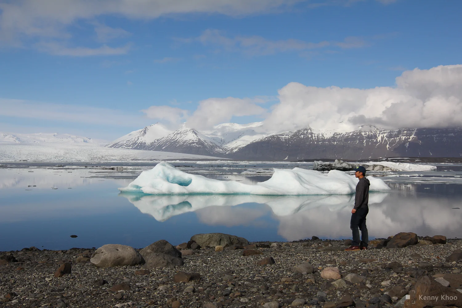 The stillness of the Jökulsárlón glacial lake creates mirror-like reflections of the icebergs.