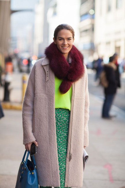 Introduce a contrasting color by wrapping it around your neck.