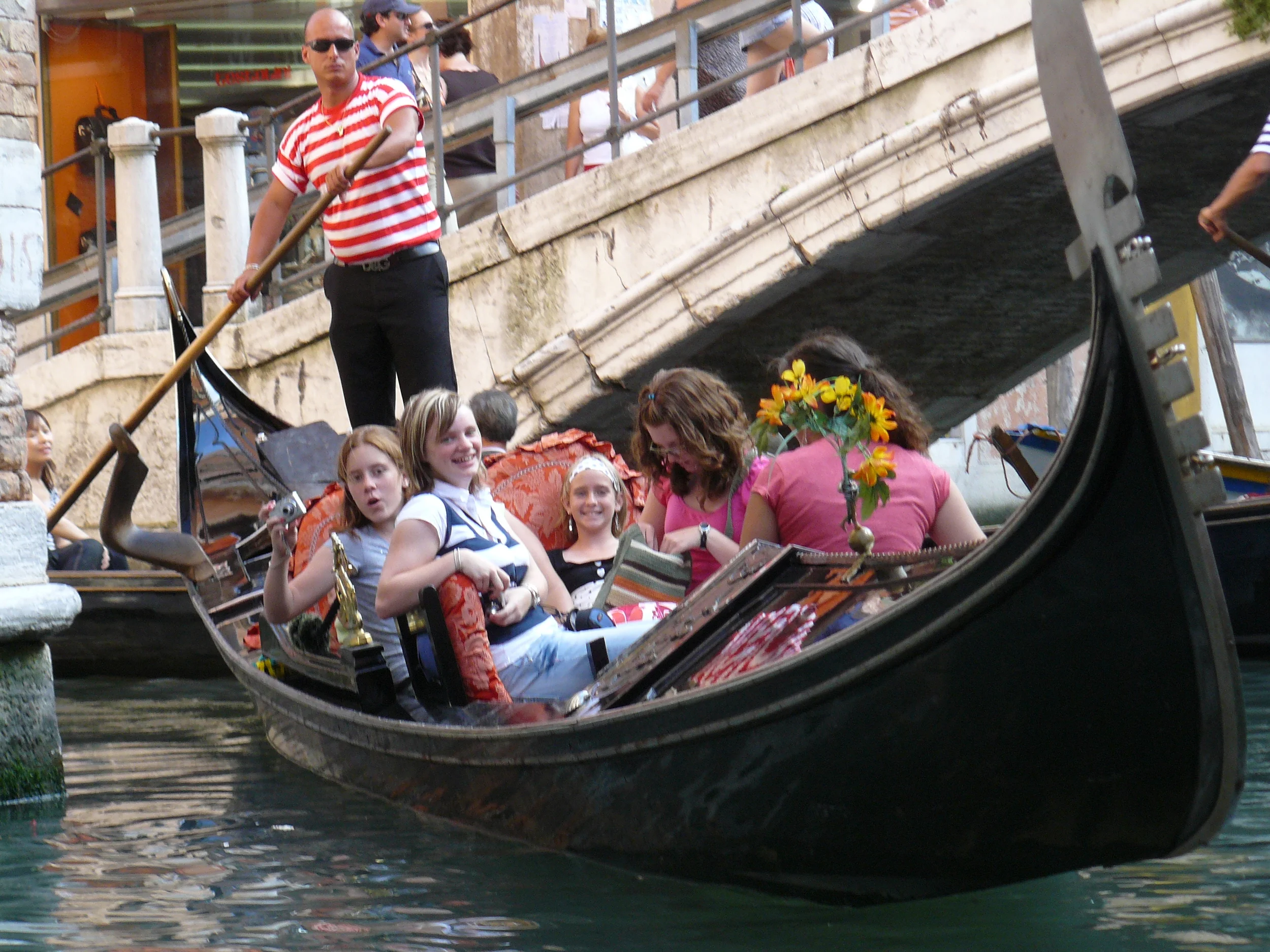 Enjoying a gondola ride through the narrow canals in Venice.