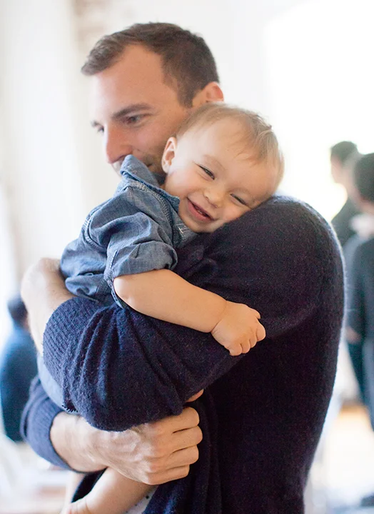 The birthday boy gets a papa snuggle!