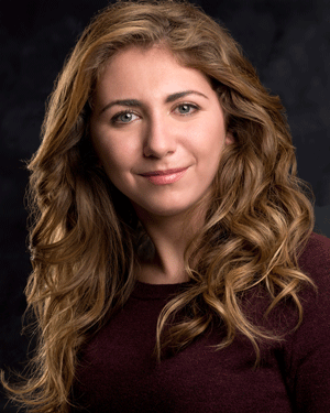 Rebecca Lerman plays the office boy and a member of the ensemble.