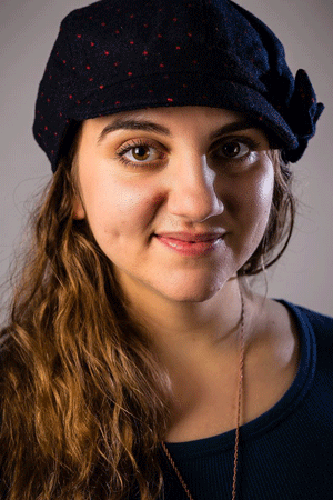 Caitlin Gjerdrim plays Judah Touro and is a member of the ensemble.