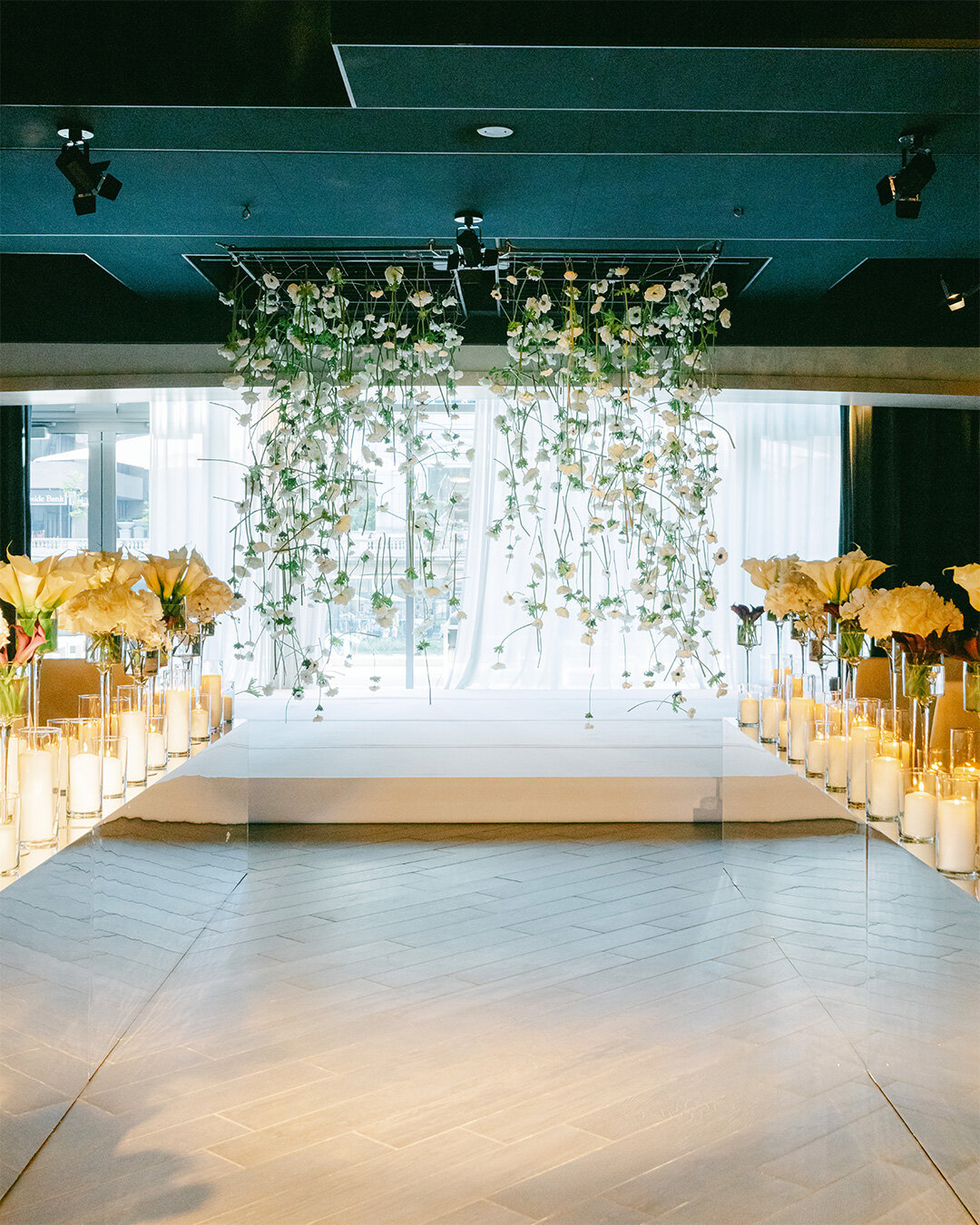 Suspended blooms surrounded Faran &amp; Garrett as they said their vows at the beautiful @rpmeventschicago 

Planning by @johnnametcalf @bigcitybride 
Beauty by @rarebirdbeauties 
Decor by @revel_decor 
Music by bkobeatmix 

#chicagoweddingphotograph