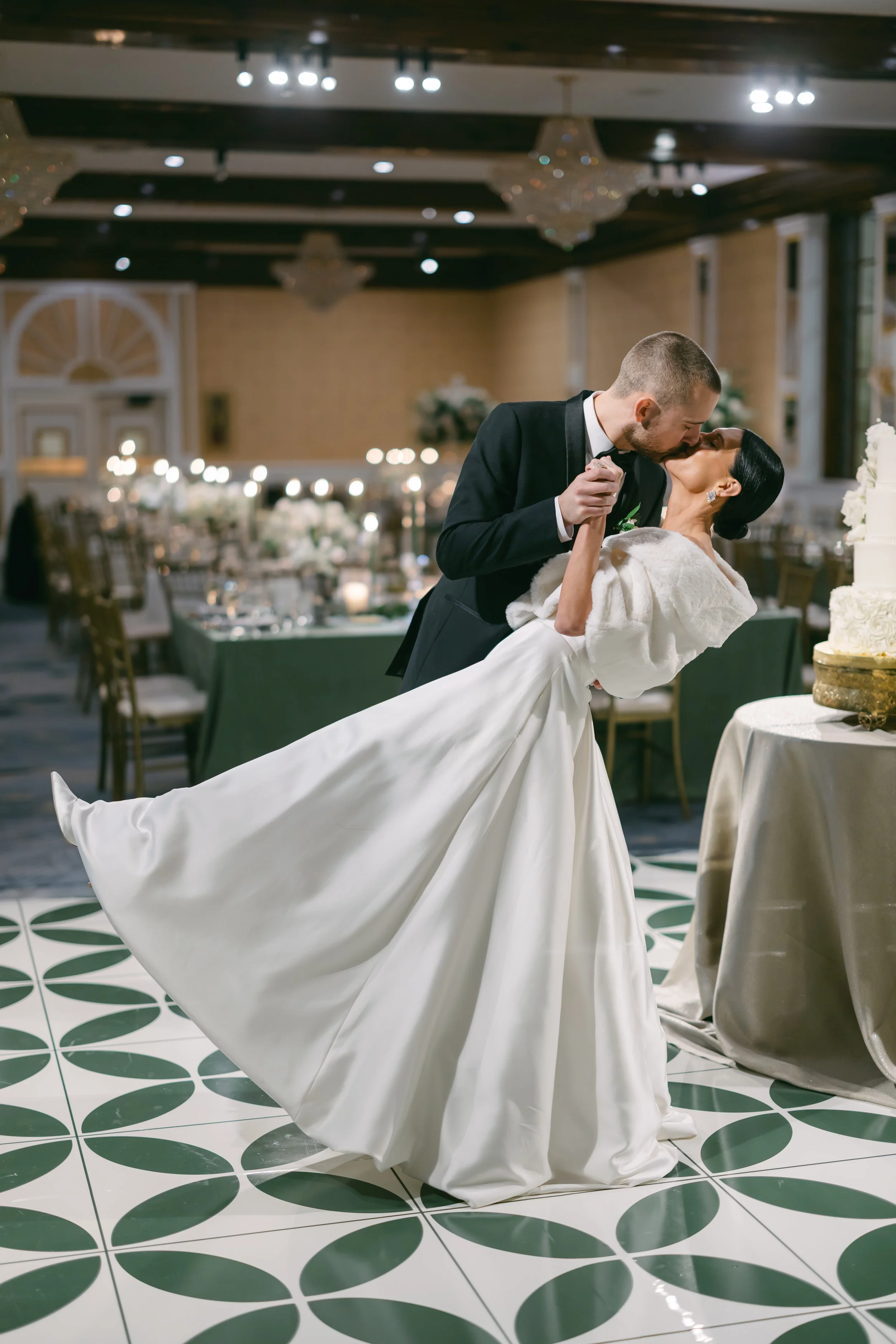 bride and groom Winter wedding reception at The Drake Oak Brook with green linens and candlelight