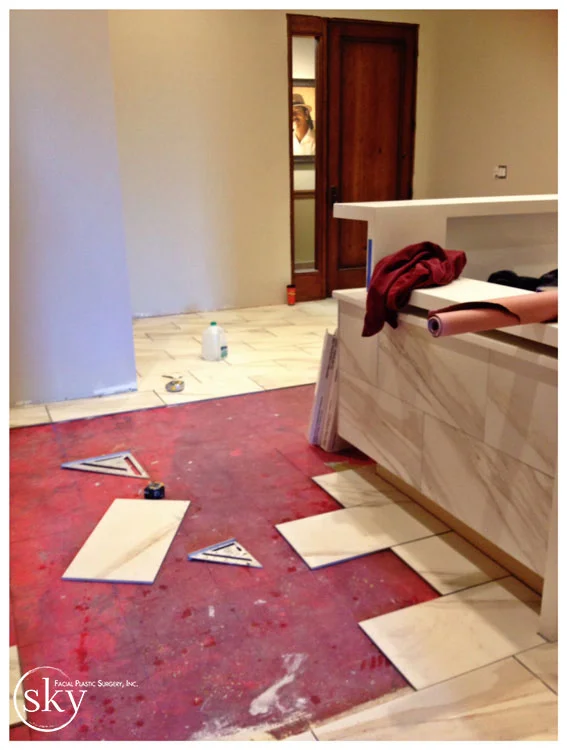 PHOTO: Floor in lobby being installed.