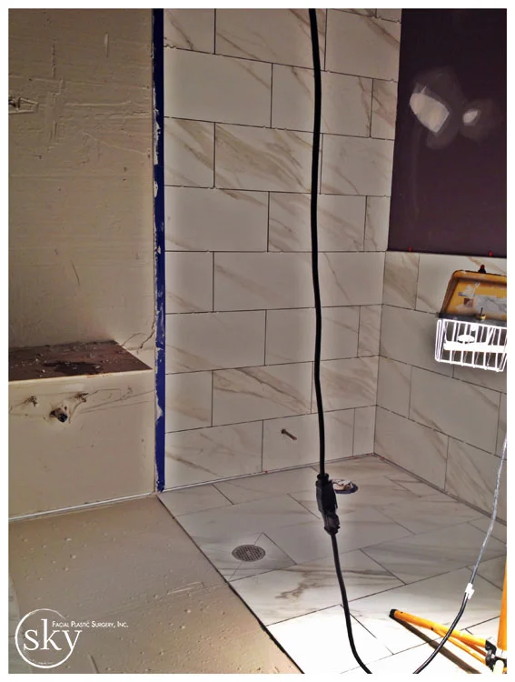 PHOTO: Bathroom, partially tiled.