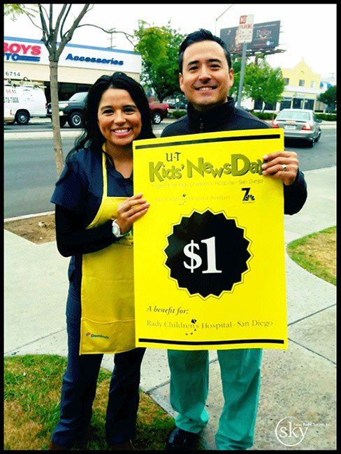 PHOTO: Dr. Yoo and Ariana with Kids' NewsDay Poster 