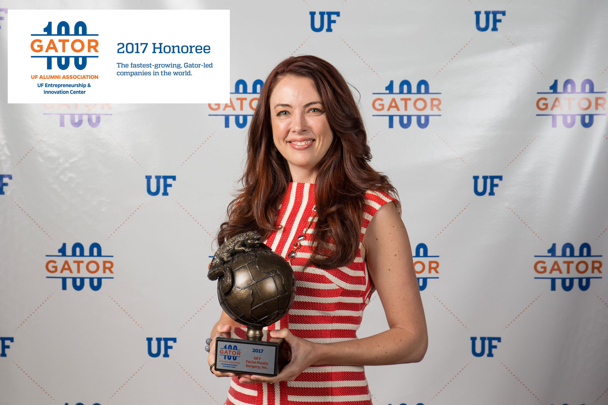 SKY's VP Amber accepts the Gator100 award on behalf of SKY Facial Plastic Surgery, ranked the 34th fastest growing Gator-led companies in the world.