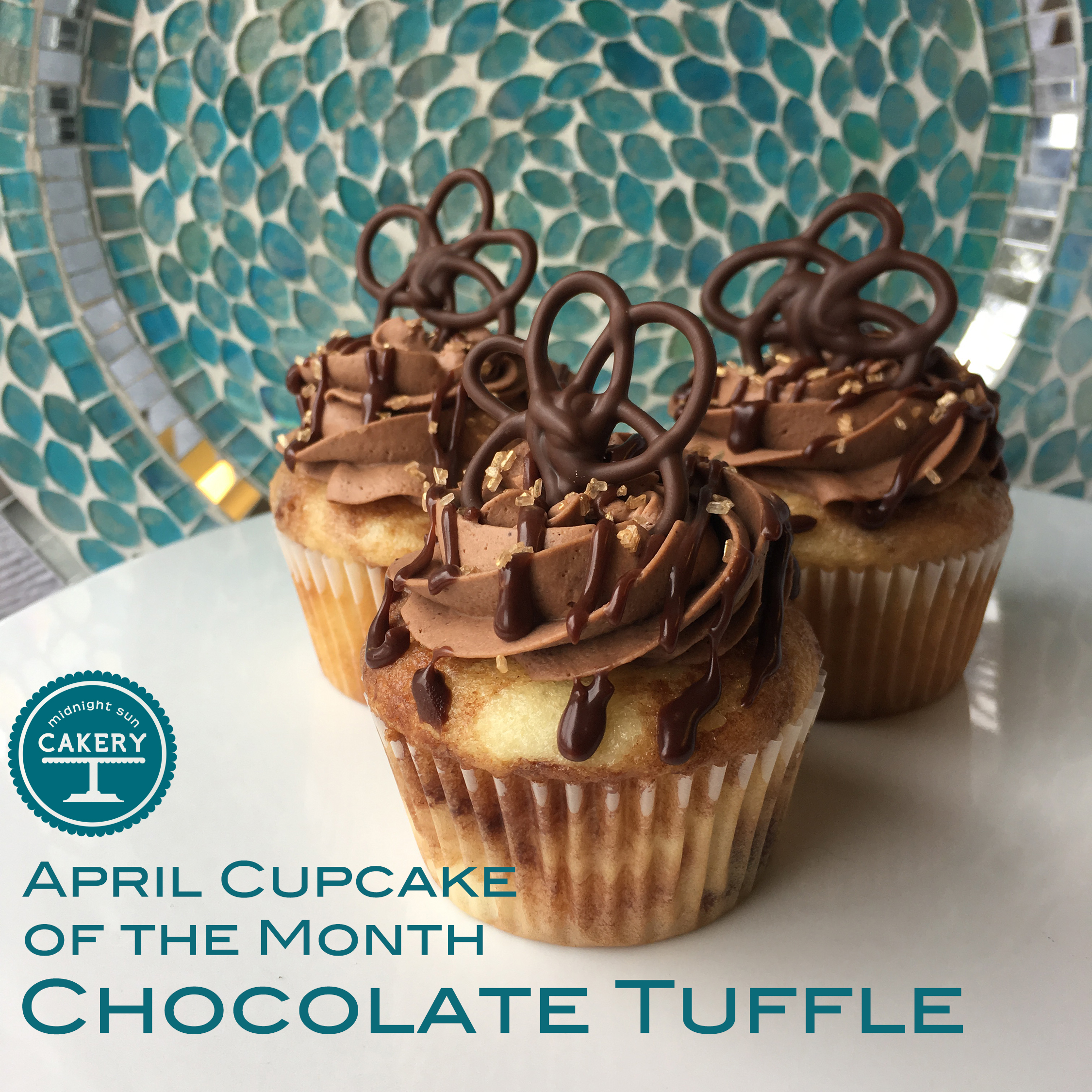 $25 a Dozen These are baked with our white almond cake with marblized ganache, iced with a lightly sweetened chocolate mousse, and then drizzled with more ganache!