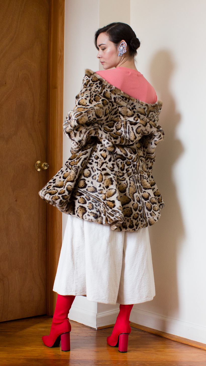 Asymmetric faux fur jacket, white wide leg pants, red sock shoes and pink short sleeve top