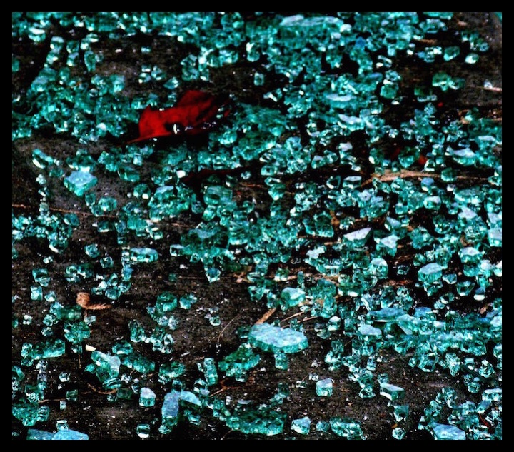 Shards of broken glass. The many shapes of each piece of glass and the reflection of light beaming it.