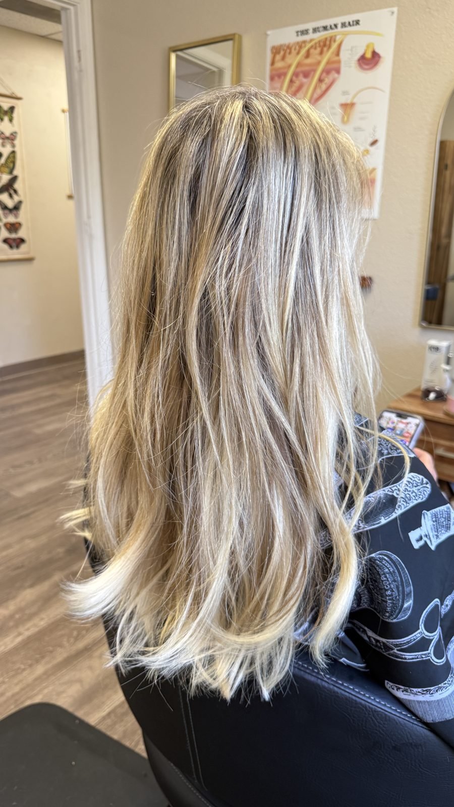 Dimensional blonde highlights with soft layers and waves at a Boise hair salon