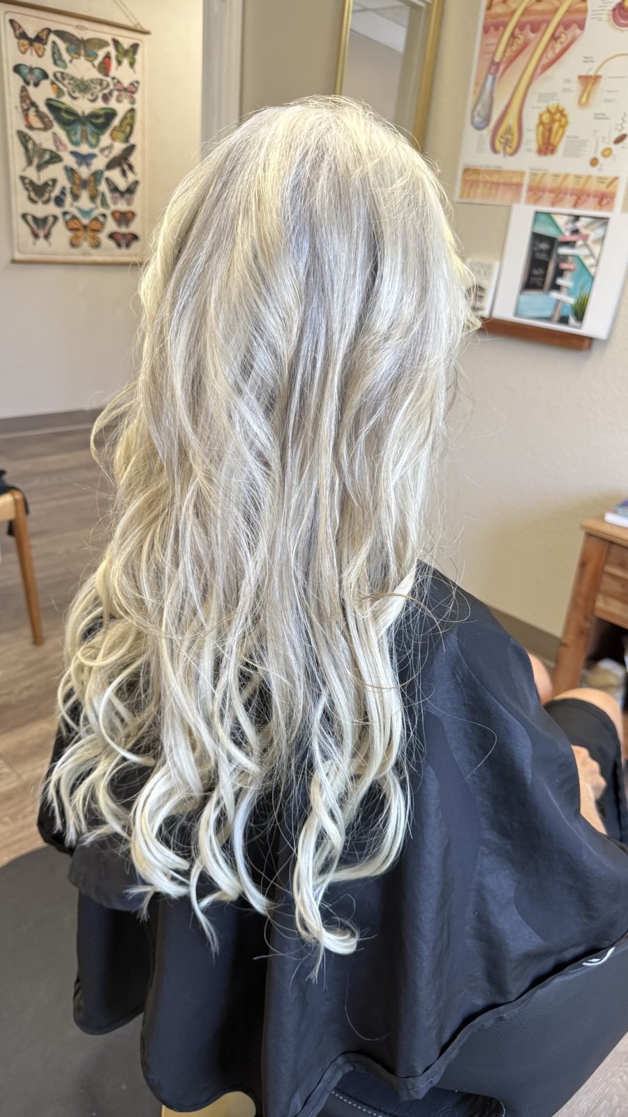 Finished long curled silver blonde hair with microbead extensions in Boise, Idaho
