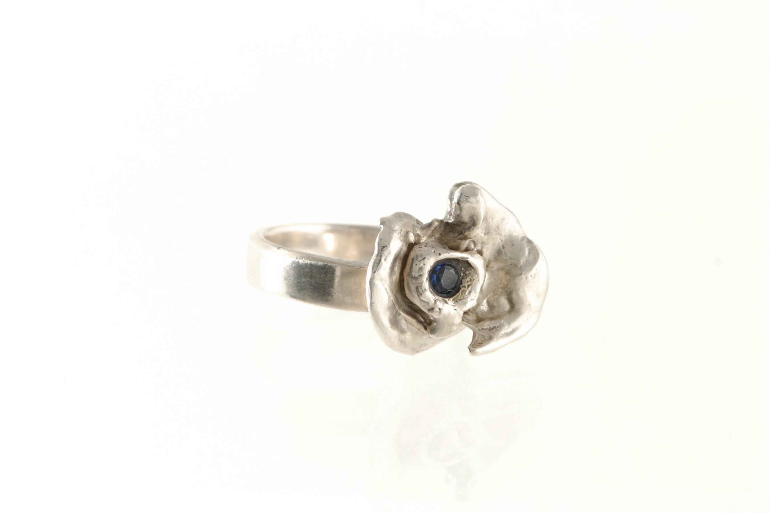 OOAK silver flower ring with blue CZ.