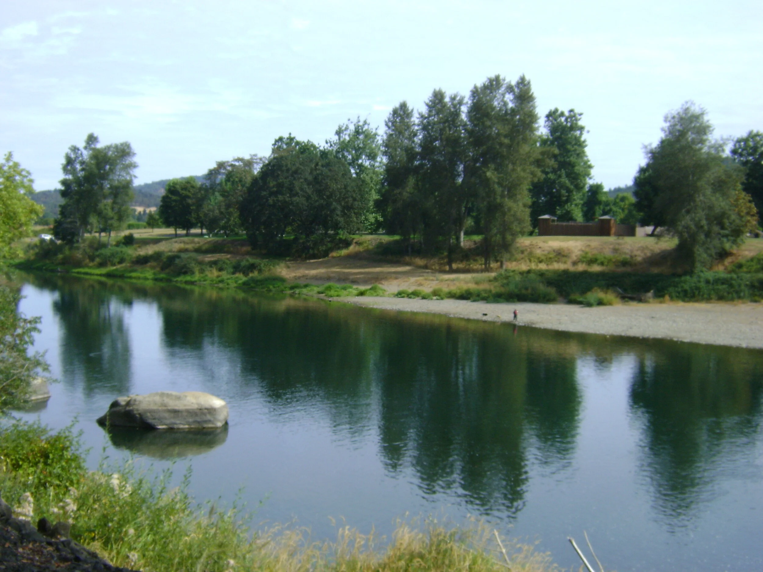  Looking across the river at River Forks Park, the confluence of the North and South forks of the Umpqua River, the location of many family outings. This particular rock is great for diving/jumping. 