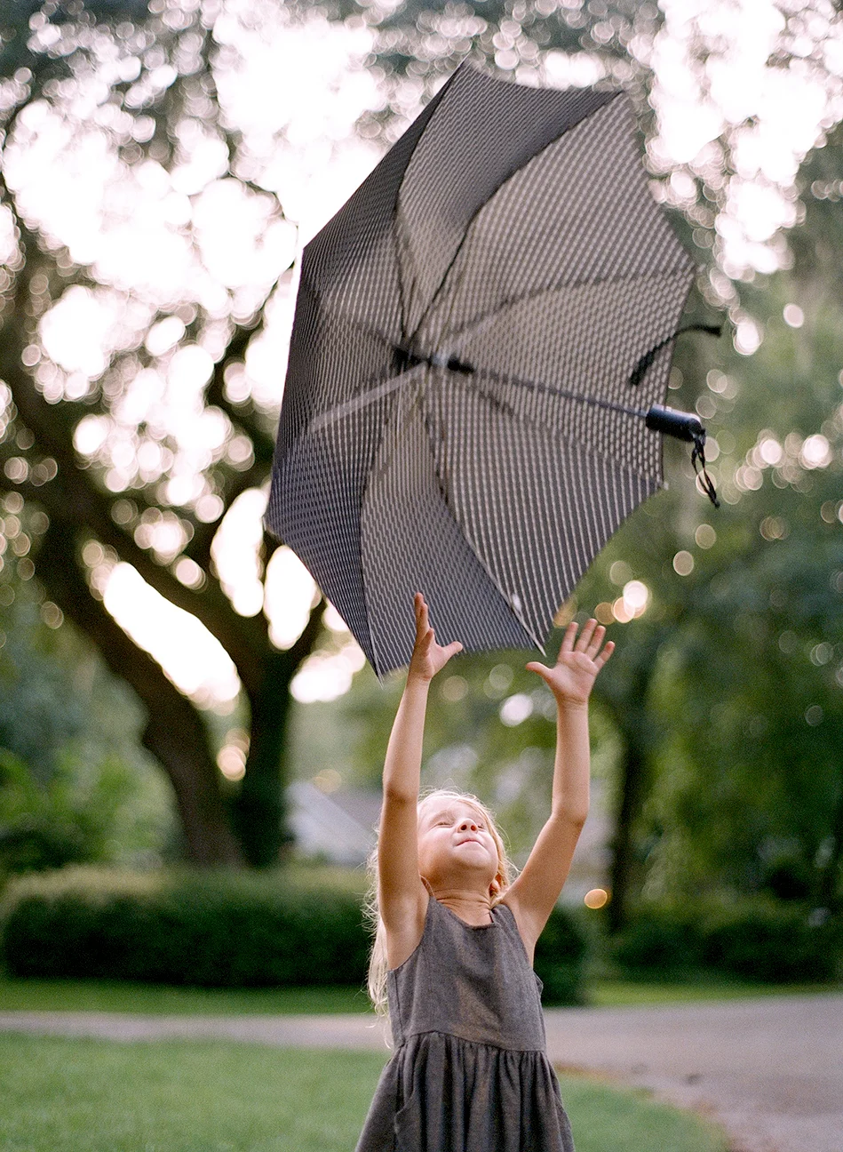 Josie Tossing Umbrella_Clarks.jpg