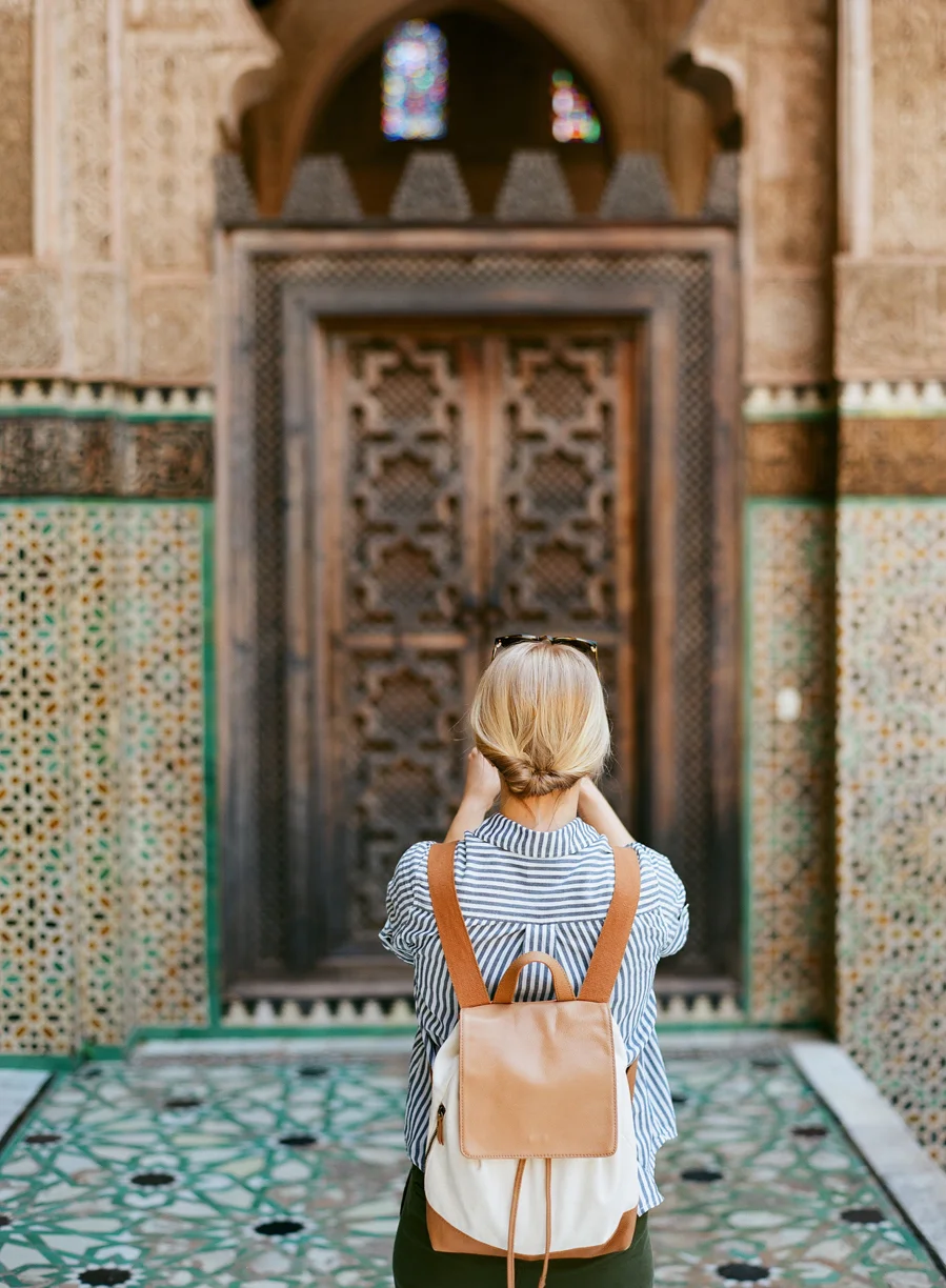 Allison Taking a Picture of Door Inside Mederssa El Bouanania_Fez Medina_web.jpg