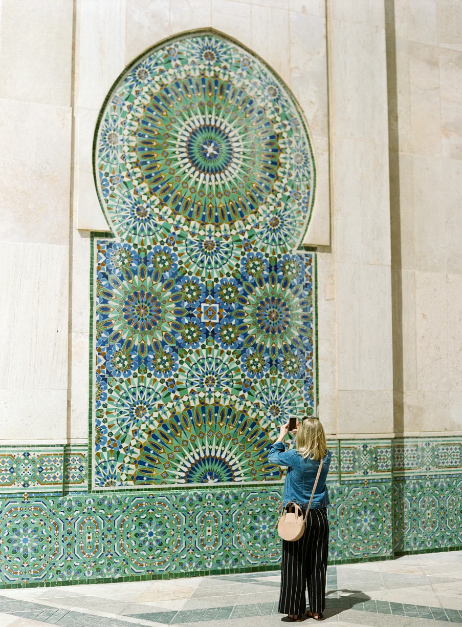 Allison taking an iphone pic of tiled wall_hassan mosque II_web.jpg