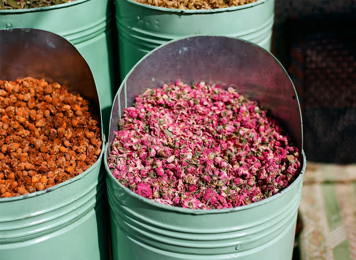 Dried Rose Pink Flower Petals inside teal metal bin_Marrakech_web.jpg