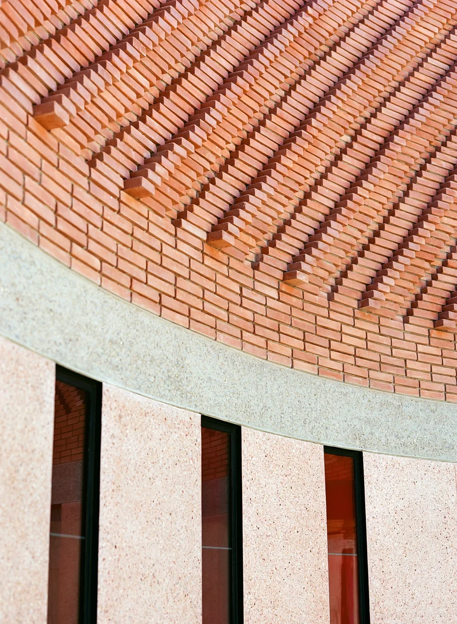 Curve in Exterior Wall of YSL Museum_3 windows and brick work_web.jpg