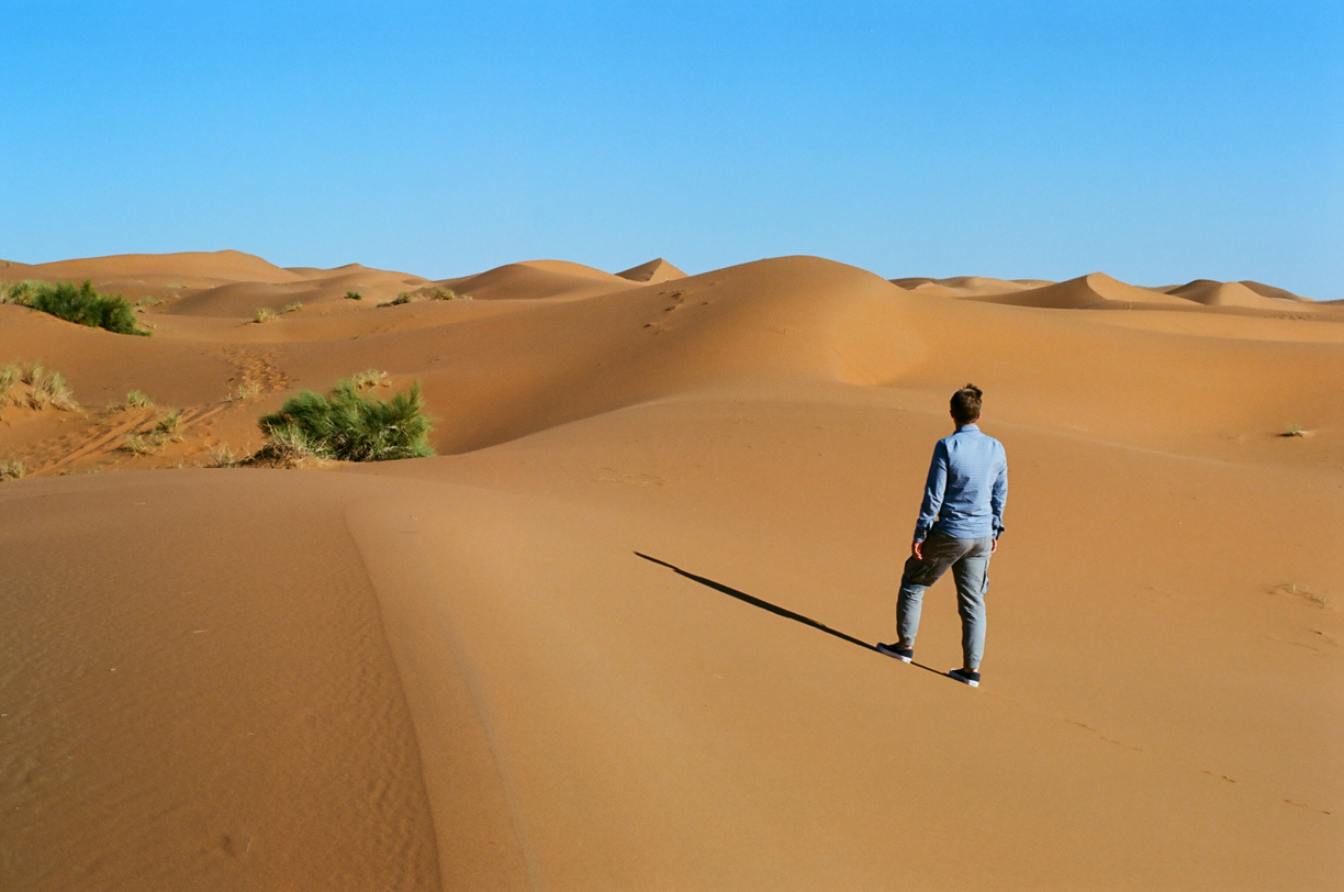 Cole Looking out at the dunes in the sahara desert_from behind_web.jpg