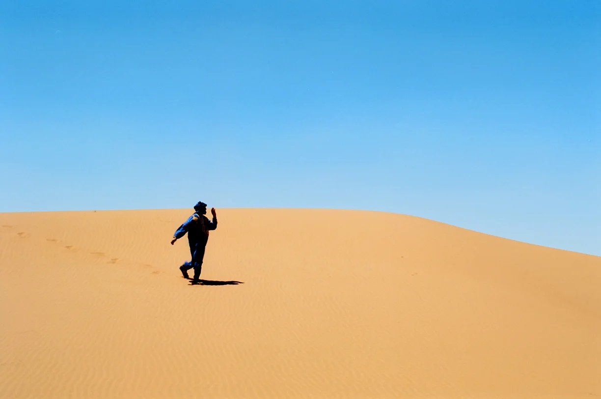 Camel Guide Walking down dune_Sahara_web.jpg